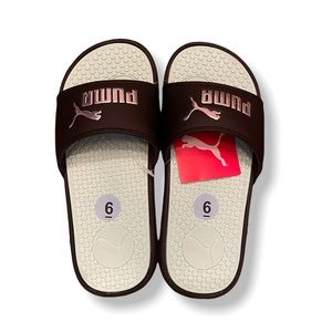 Black Puma Slides. Never worn. NWT. Size 6 boys. Silver lettering.